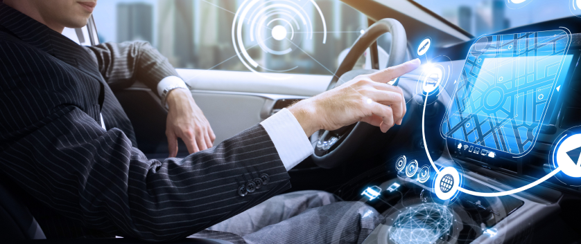Person interacting with a digital interface inside a connected car, representing private networks and connectivity solutions.