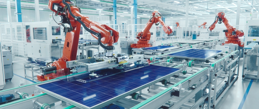 Robotic arms assembling products in a factory, emphasizing value engineering and optimized product lifecycles.