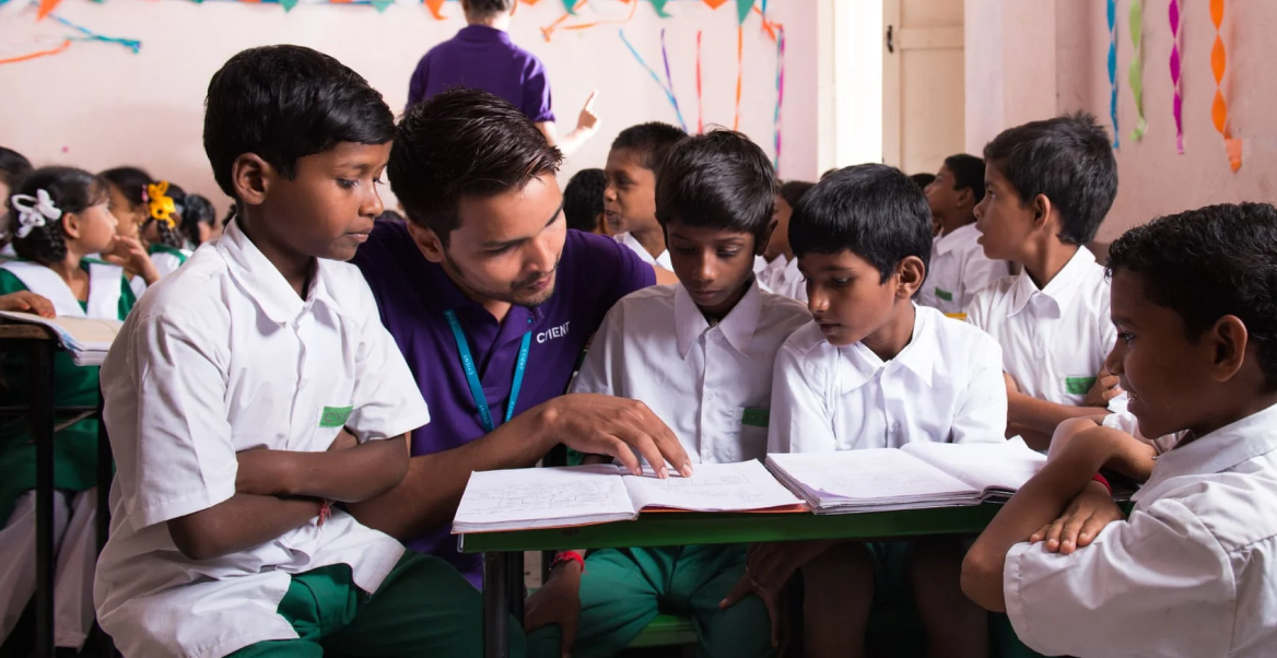 Cyient volunteers teaching students