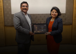 NASSCOM Spotlight Award 2023-24 with a picture of two executives holding the award.