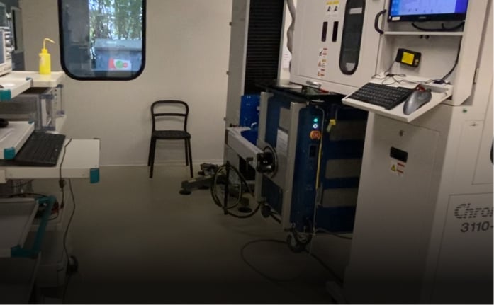 Features a controlled lab space with engineers testing components, focusing on safety and reliability.