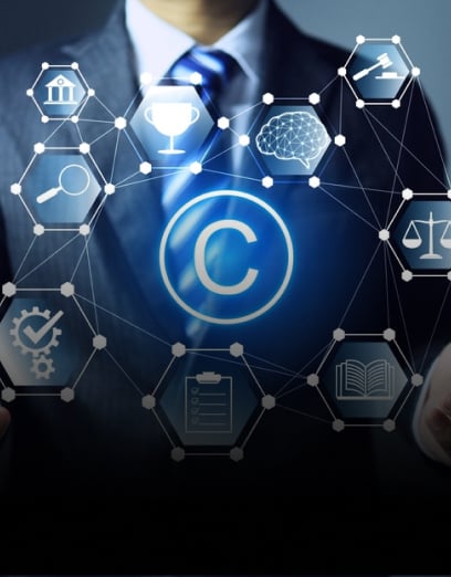 A business professional in a suit standing in front of a network visualization highlighting 135 patents, symbolizing innovation and intellectual property.