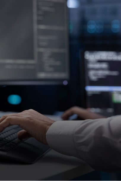 A technician operating high-tech computer systems in a sophisticated data environment, emphasizing software development expertise.