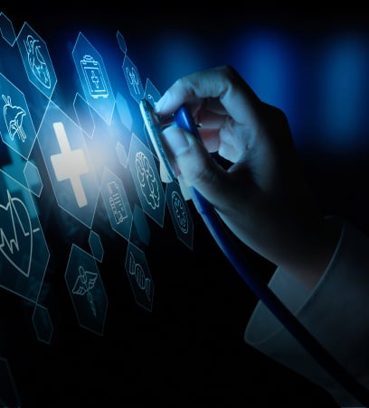 A close-up of a doctor’s hand holding a stethoscope, hovering over holographic healthcare icons like crosses, charts, and medicine bottles, symbolizing Digital Healthcare innovation.