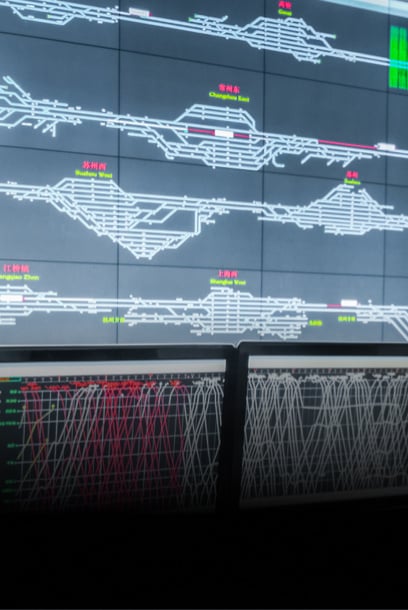 A control room display showing railway signaling and track infrastructure diagrams.