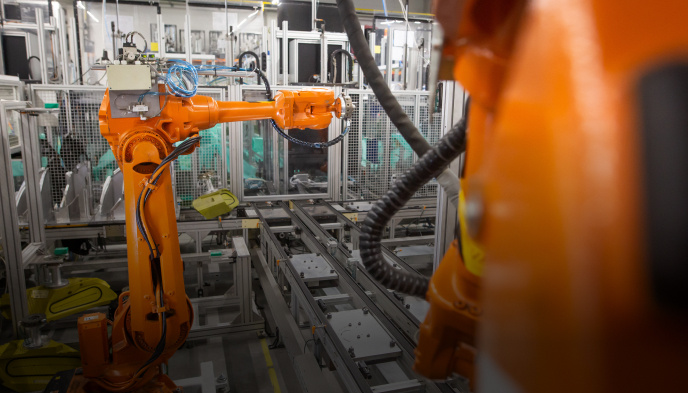Industrial robotic arm in an automated factory setting
