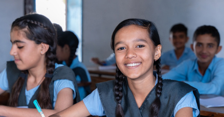 Children in school smiling 