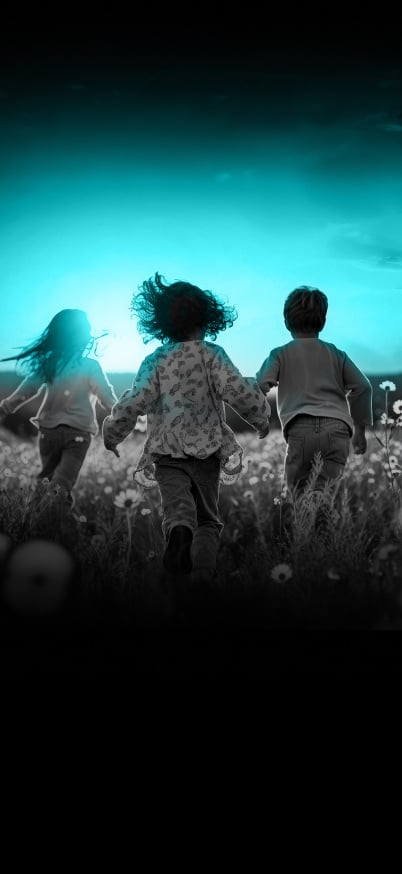 Children running in a flower field