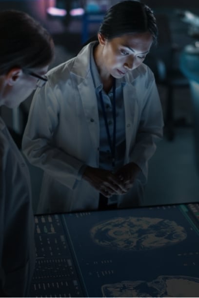 A healthcare professional analyzing digital data overlays in a medical setting, emphasizing innovation in connected healthcare.