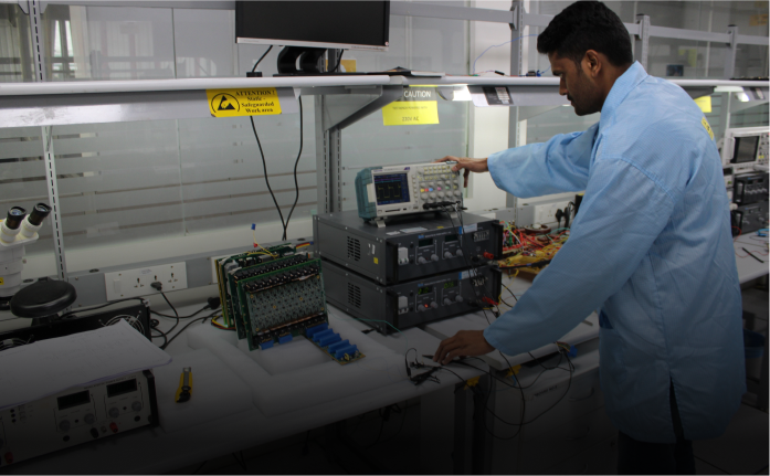 Engineers working in Power Electronics ]Lab, showcasing innovation hubs at Cyient.