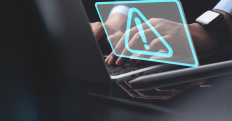 Laptop with a warning symbol