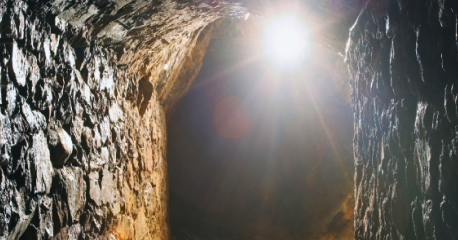 Light illuminating the interior of a mine, symbolizing data management in mining operations.
