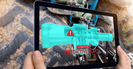 Augmented reality tablet view of industrial machinery highlighting predictive alerts and real-time monitoring.