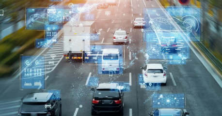 Vehicles on a smart road with data overlays.